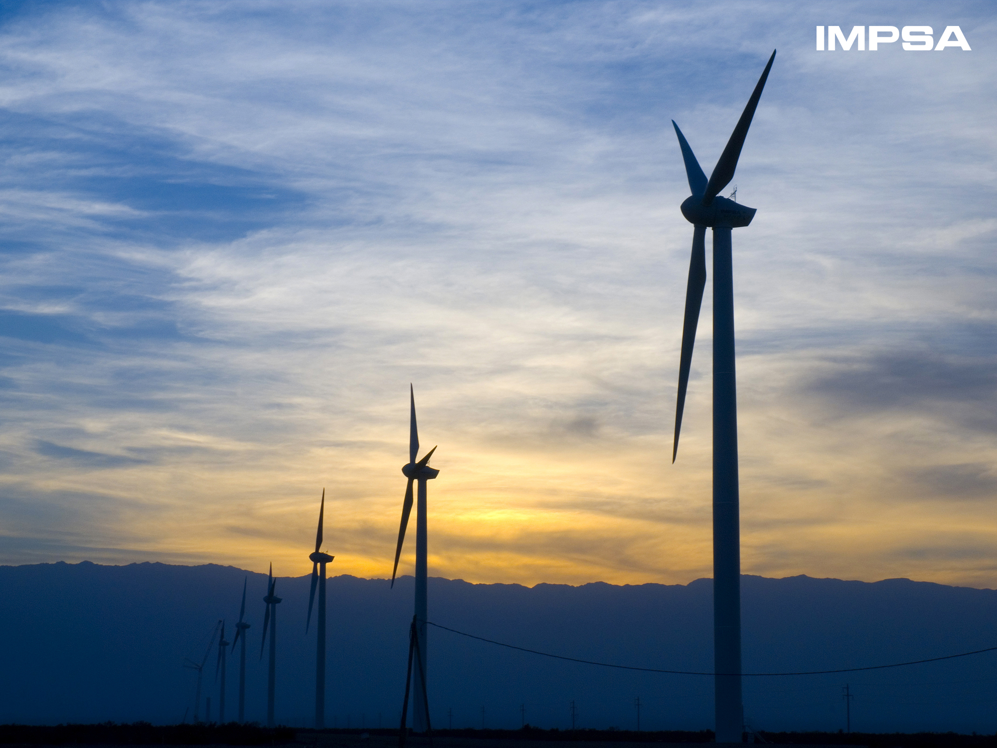IMPSA wind turbines at sunset